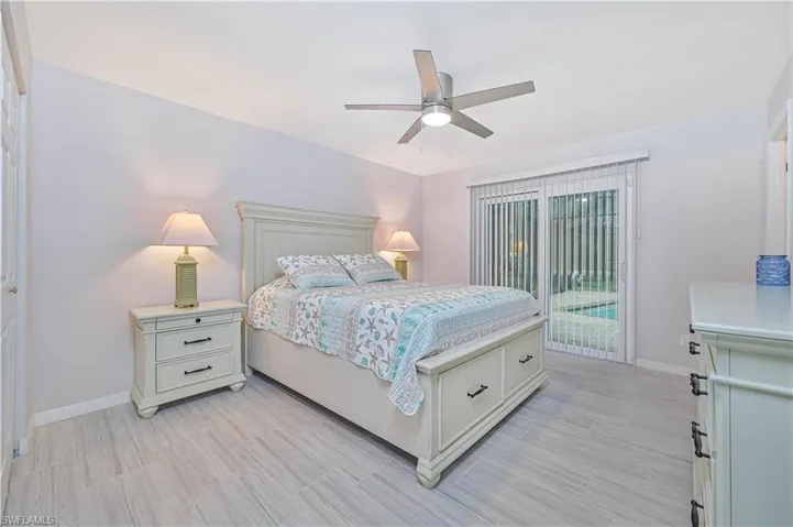 Bedroom with access to exterior and ceiling fan