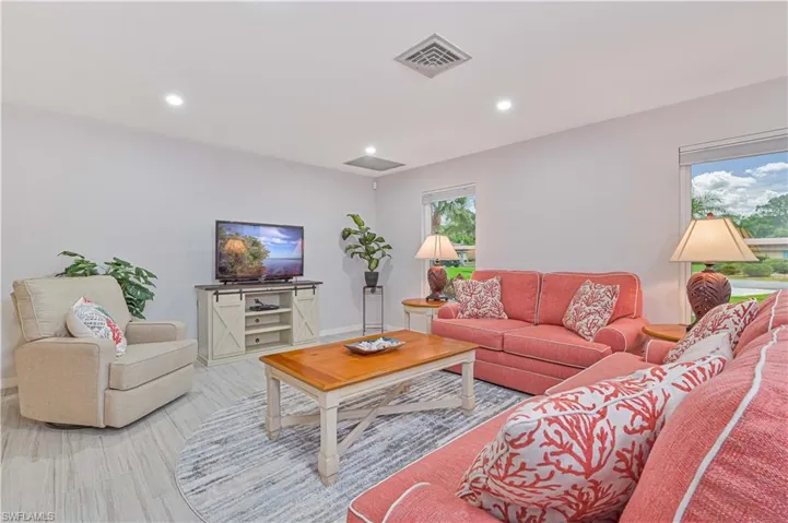 Living room with light hardwood / wood-style flooring