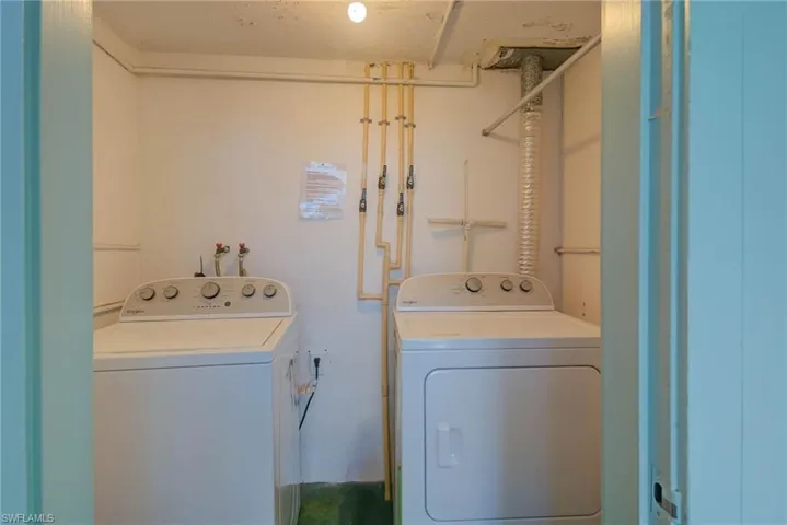 Laundry room featuring washer and dryer and laundry area