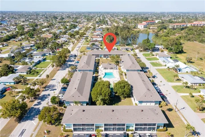 Aerial view featuring a residential view and a water view