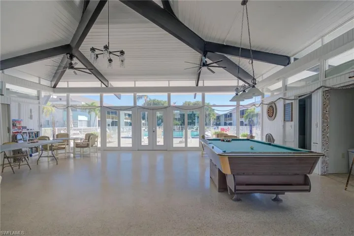 Playroom featuring beam ceiling, speckled floor, ceiling fan, and billiards