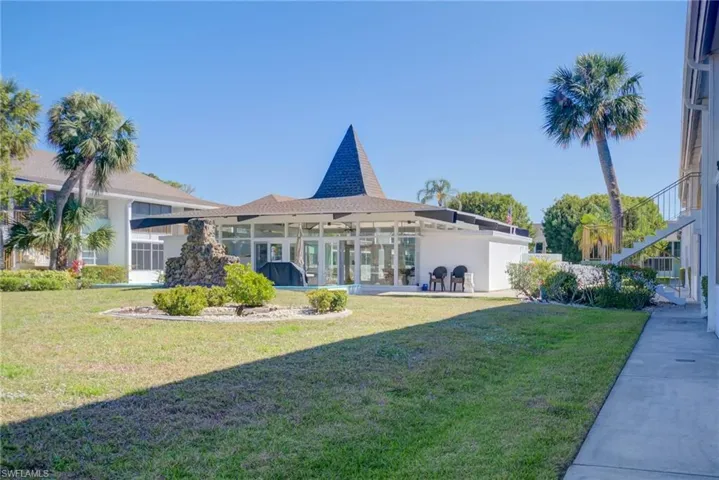 Rear view of property featuring a yard