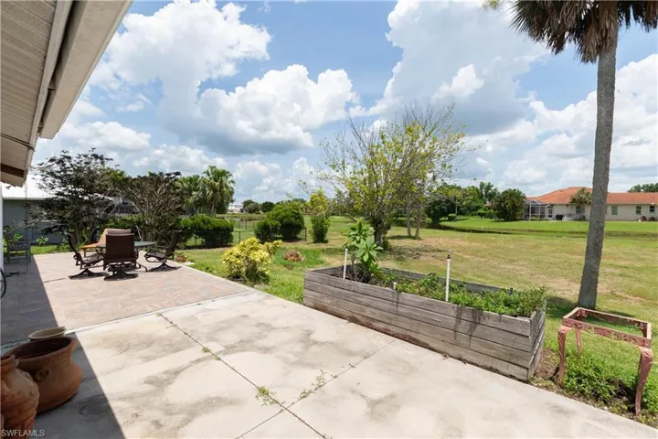 View of patio with a vegetable garden