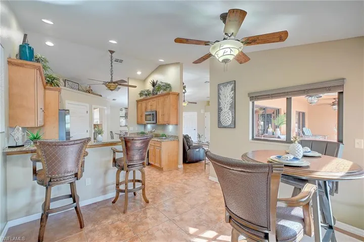 Designer Kitchen with custom upgraded cabintry, lighting and spcaious eat in kitchen nook.
