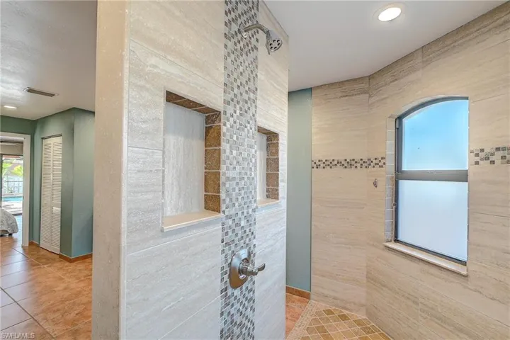 Custom Walk through shower - beautiful tiled accents throughout