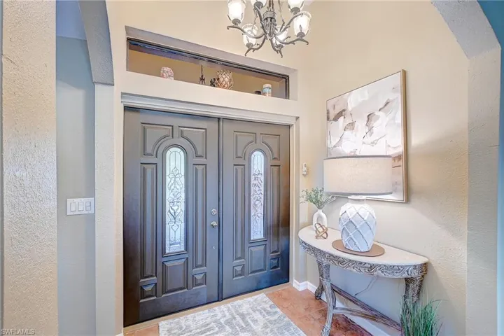Elegant Foyer Entry with custom designer double door entry.
