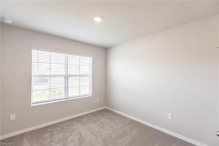Empty room with carpet floors