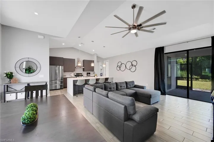 Vaulted ceilings with recessed lighting and a contemporary ceiling fan