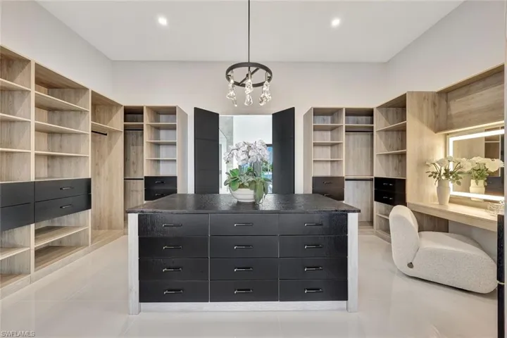 Walk in closet featuring light tile patterned floors
