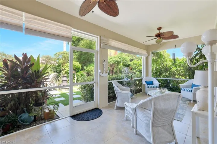 Sunroom / solarium featuring tile patterned floors