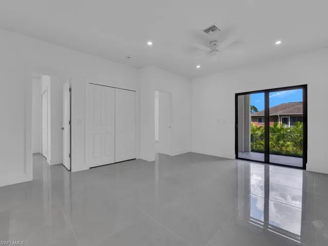 Unfurnished bedroom with recessed lighting, access to outside, ceiling fan, a closet, and light tile patterned floors