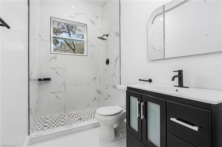 Guest bathroom 1, a glass shower door will be added.