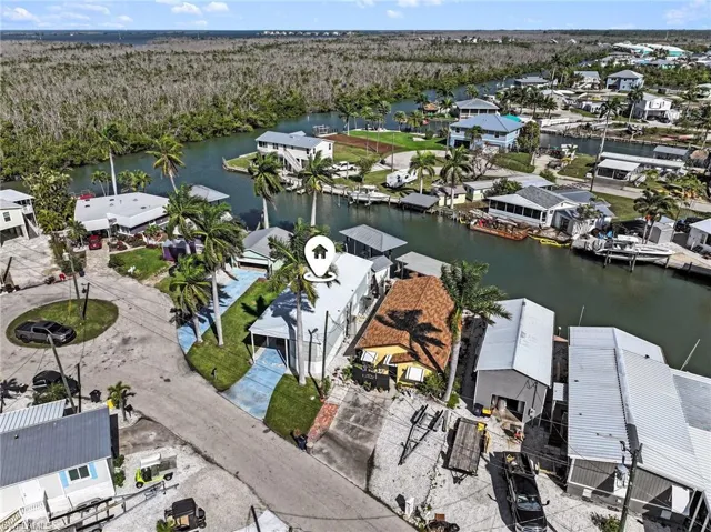 Aerial view of residential area featuring a large body of water