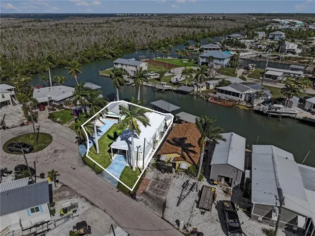 Aerial perspective of suburban area with a large body of water