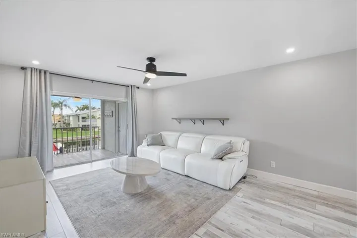 Bedroom featuring light carpet and a ceiling fan