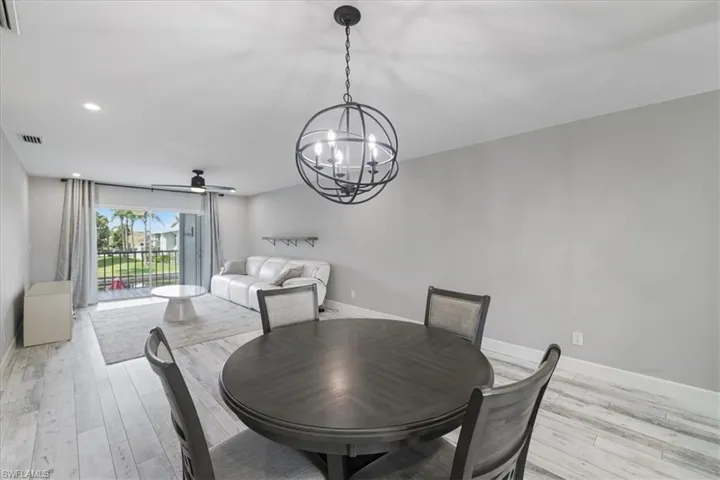 Living area with ceiling fan, recessed lighting, and wood finished floors