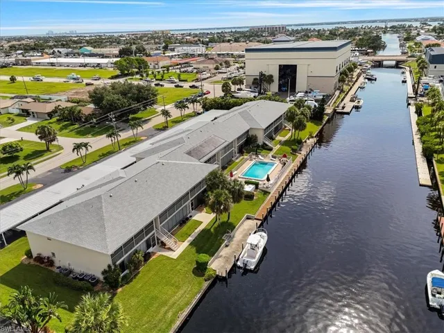 Aerial view of residential area featuring a large body of water