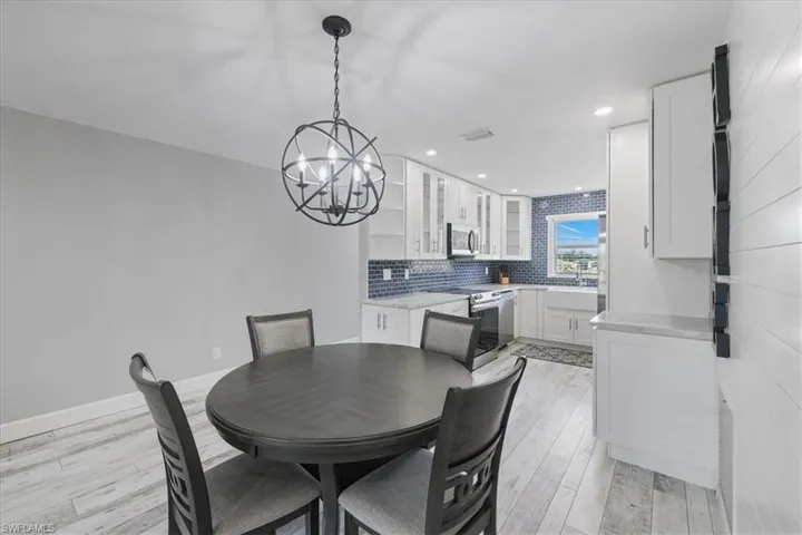 Living room featuring a ceiling fan, wood finished floors, and recessed lighting