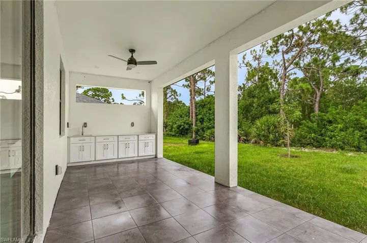 View of patio with sink and ceiling fan