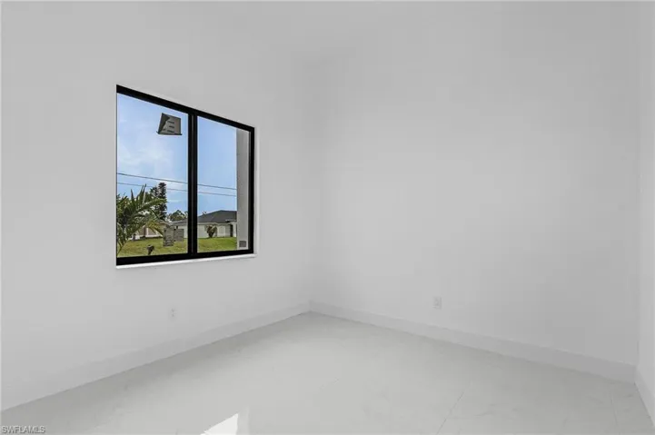 Empty room with tile patterned flooring