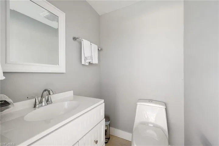 Bathroom featuring vanity and toilet
