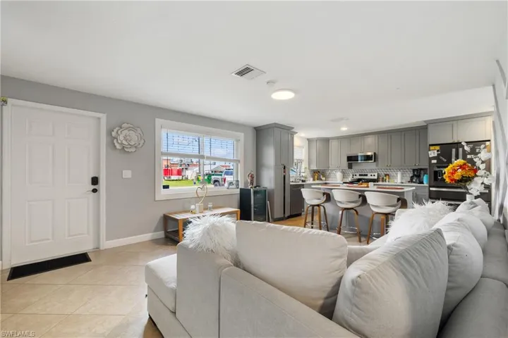 Living room featuring light tile patterned floors