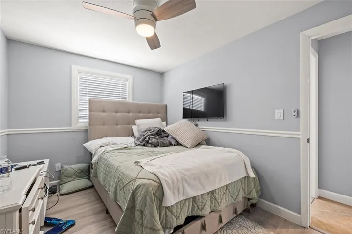 Bedroom featuring ceiling fan and light wood-type flooring