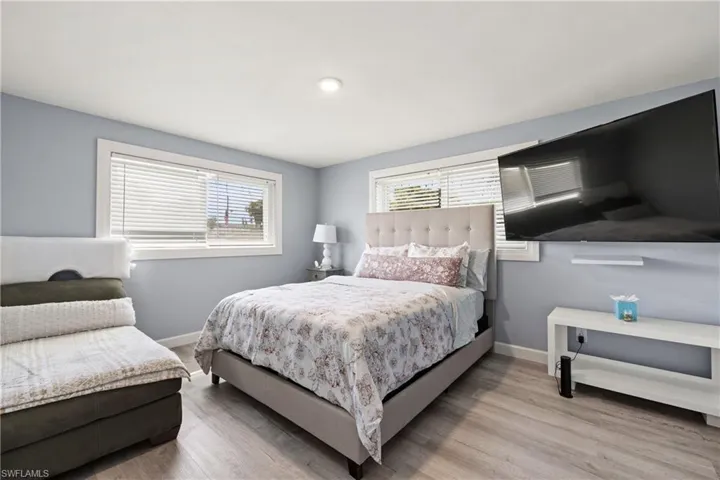 Bedroom with light hardwood / wood-style flooring