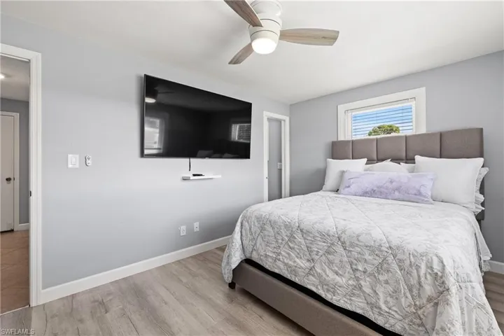 Bedroom featuring light wood-type flooring and ceiling fan