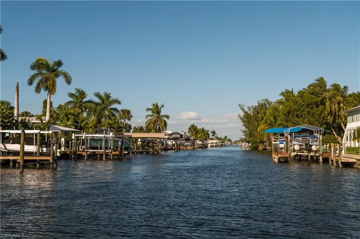 Dock area with a water view and boat lift