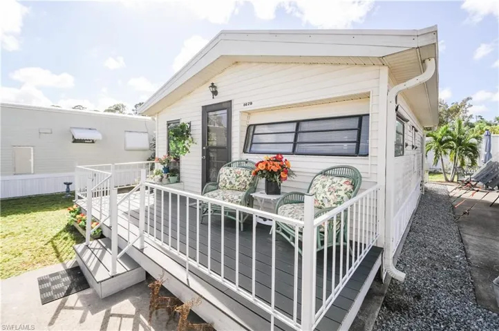 Back of house with a wooden deck