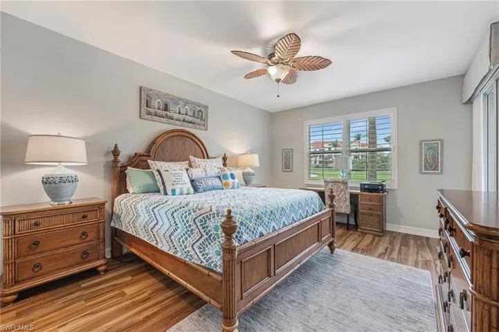 Wake up to stunning golf course views, enhanced by elegant plantation shutters.