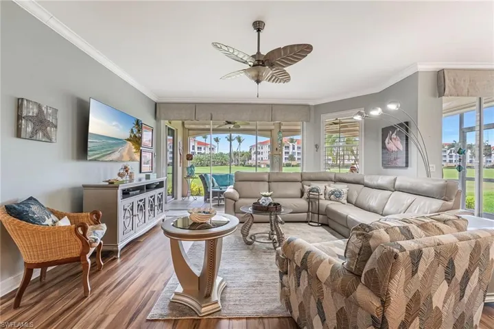 Full hurricane protection provides peace of mind, while abundant natural light fills the space and luxury vinyl flooring flows throughout the home.