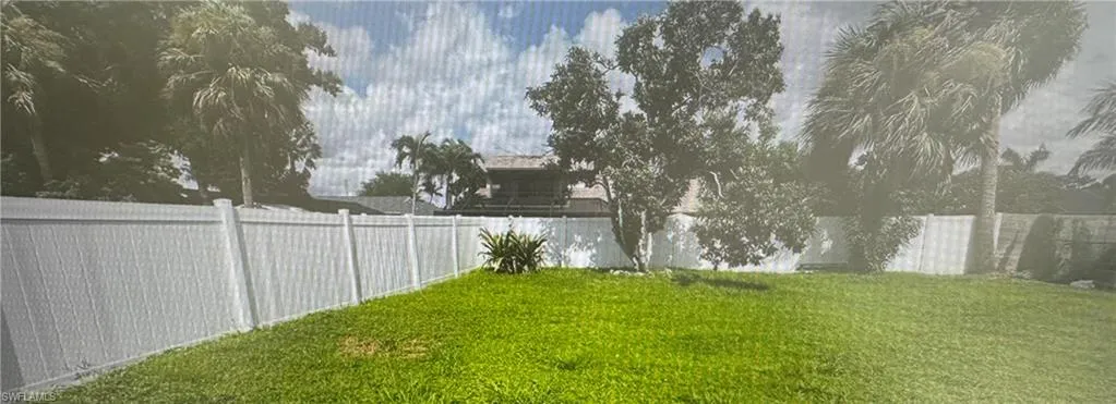 View of fenced backyard