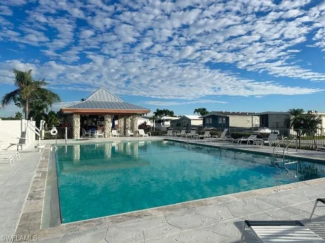 View of pool with a patio and a gazebo