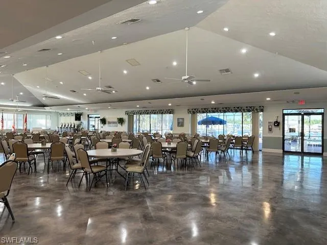 Dining space featuring ceiling fan and a textured ceiling