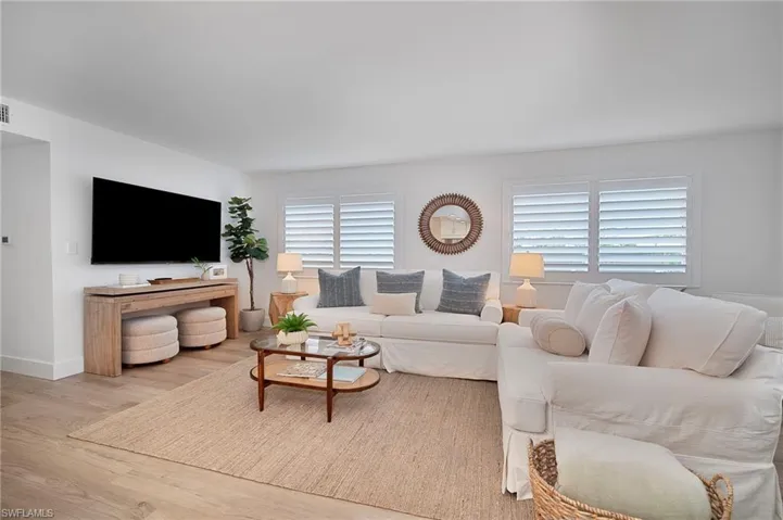 Living room featuring wood finished floors and baseboards