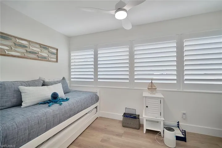Bedroom with light wood-type flooring and ceiling fan