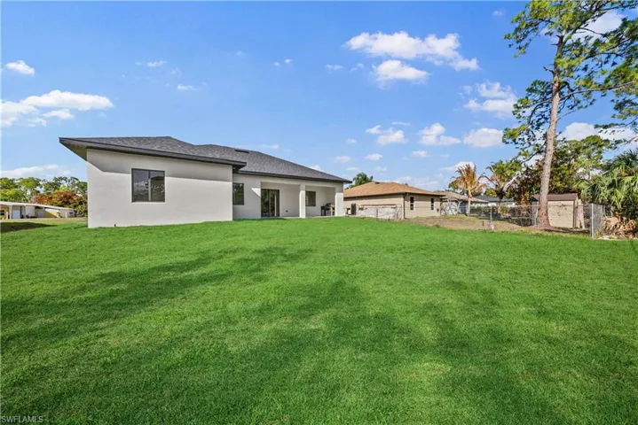 Back of property featuring a patio area and stucco siding