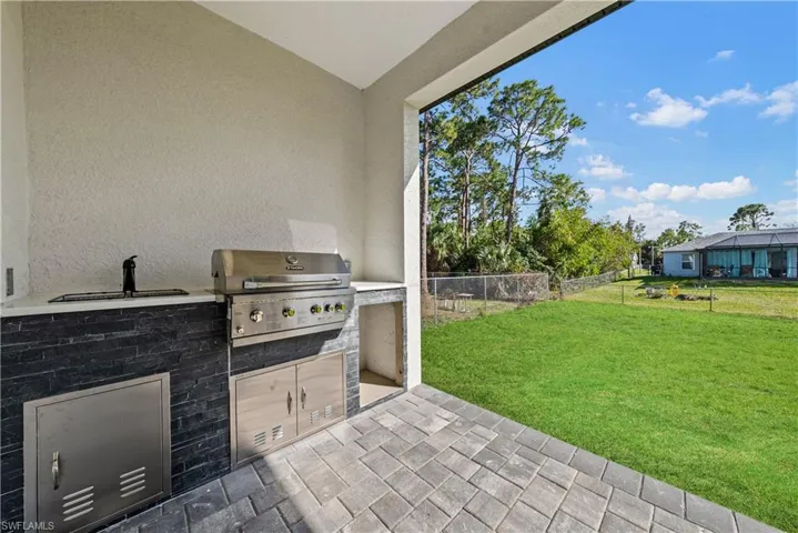 View of patio with exterior kitchen