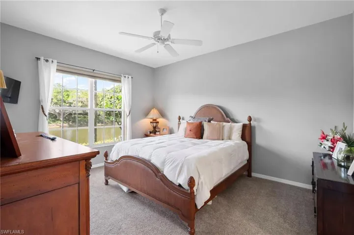 Room with light gray wall paint and carpeted flooring