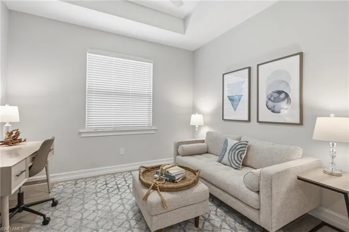 Wood look tile floor, tray ceiling, dual glass French entry doors