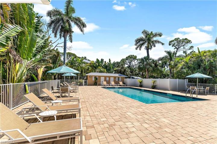 The smaller pool, deck, tables & chairs