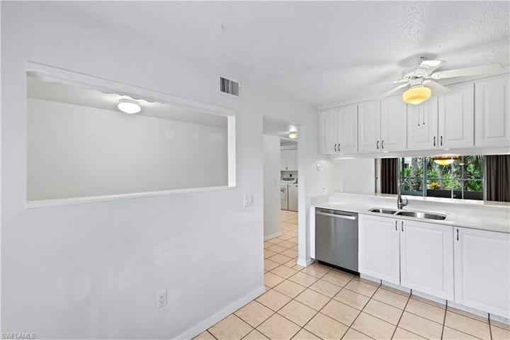 Kitchen with opening to the hallway