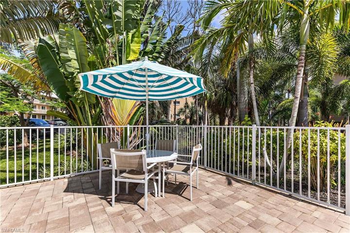 Small pool with comfy tables & chairs