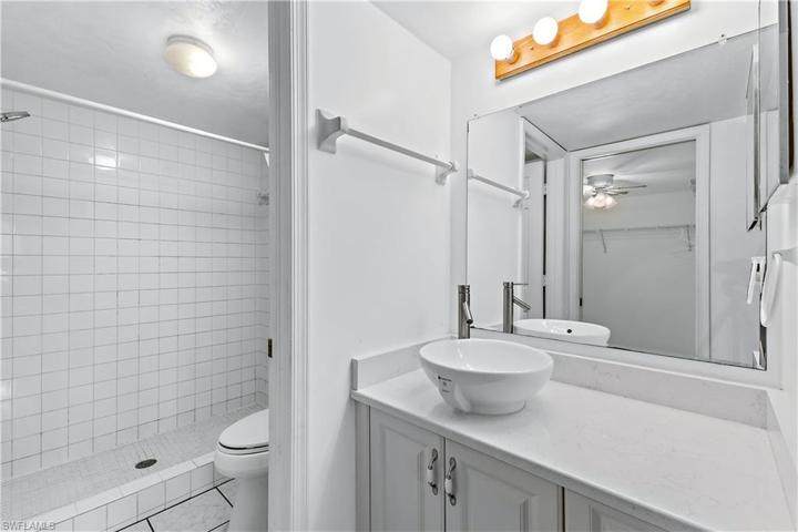 Master bathroom with vanity,  & shower rooms