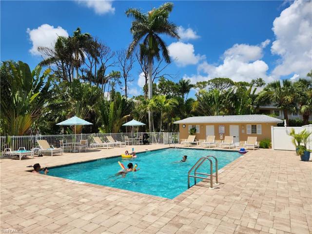 The smaller pool, deck, tables & chairs