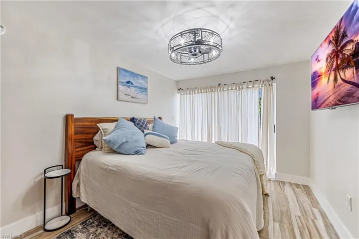 Bedroom with light hardwood / wood-style flooring