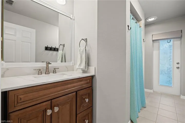Bathroom featuring vanity and tile patterned floors