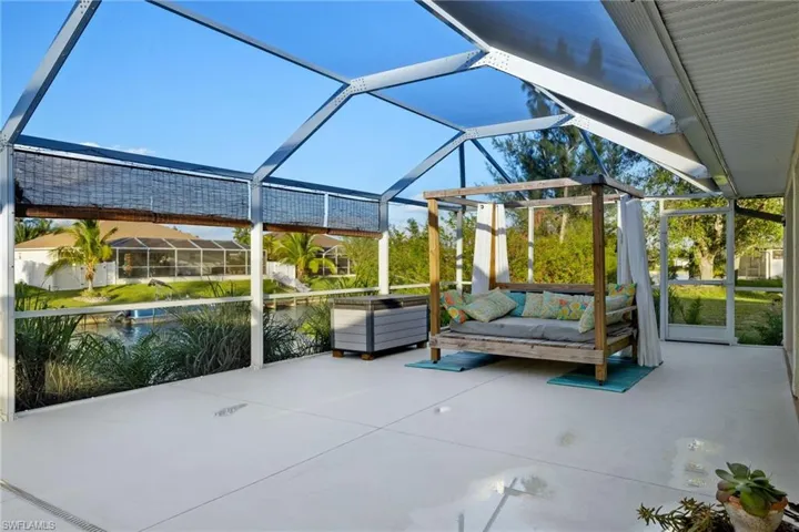 Unfurnished sunroom featuring vaulted ceiling